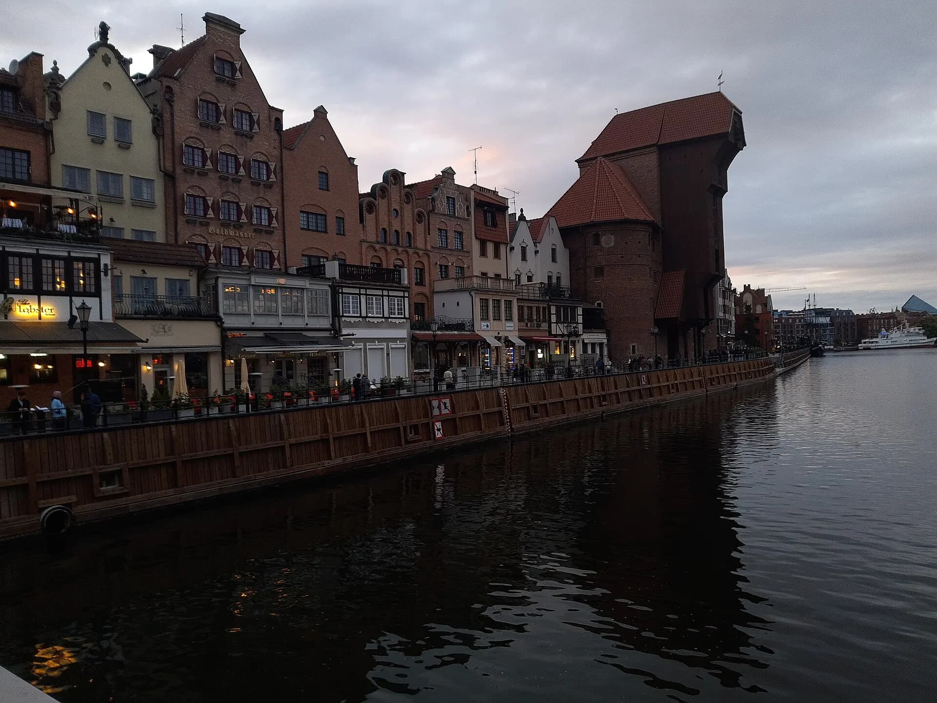 Old Town houses and port crane along Motława, Gdańsk, evening