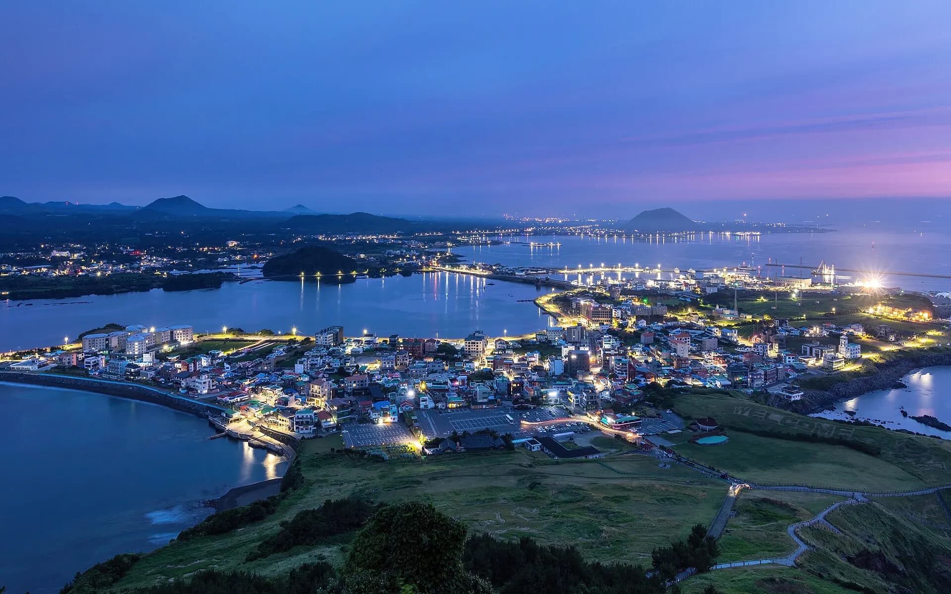 Seongsan-ri town at blue hour seen from Seongsan Ilchulbong volcano Jeju Island South Korea
